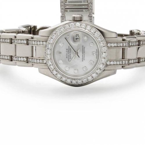 Rolex. An 18ct white gold and later diamond set calendar bracelet watch