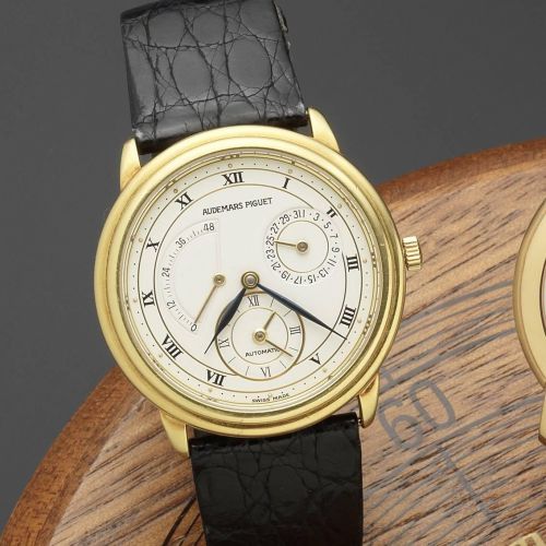 Audemars Piguet. An 18ct gold automatic calendar wristwatch with dual time-zone indication