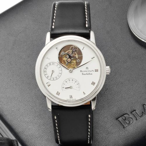 Blancpain. A fine platinum manual wind tourbillon calendar wristwatch with power reserve, together with fitted box and papers