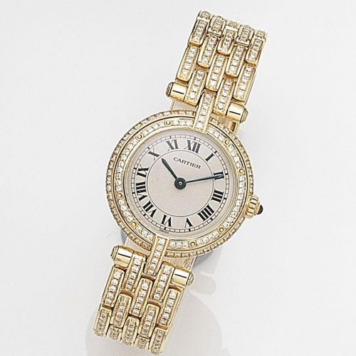 Cartier. A lady's 18ct gold and diamond set quartz bracelet watch