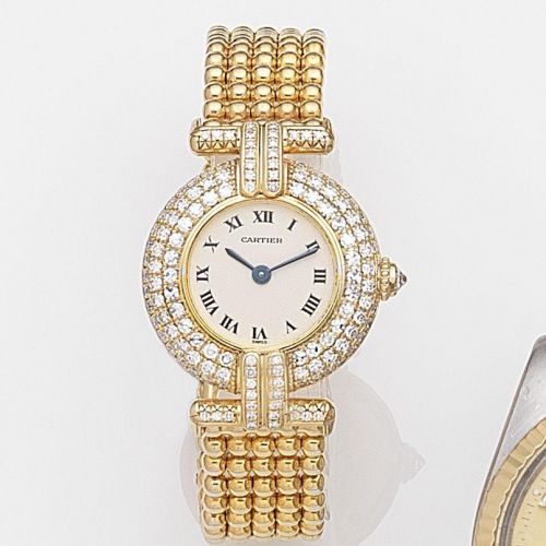 Cartier. A lady's 18ct gold and diamond set quartz bracelet watch