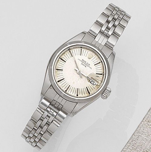Rolex. A lady's stainless steel automatic calendar bracelet watch