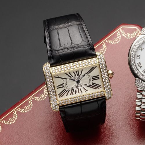 Cartier. An 18ct gold and diamond set automatic wristwatch with box and papers