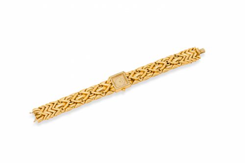 Bulgari. A fine 18K gold bracelet watch set with diamonds