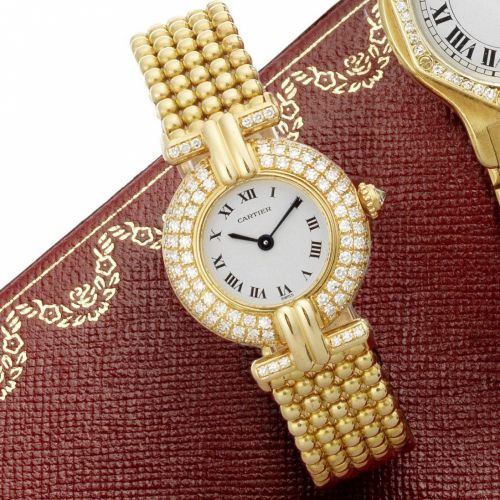 Cartier. A lady's 18ct gold and diamond set quartz bracelet watch