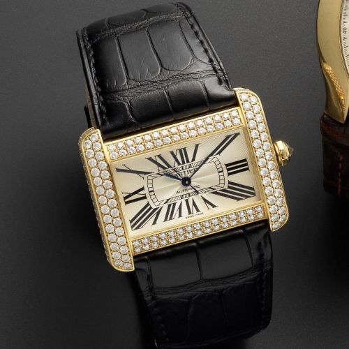Cartier. An 18ct gold and diamond set automatic wristwatch with box and papers