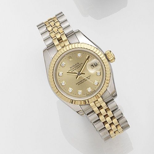 Rolex. A lady's stainless steel and gold automatic calendar bracelet watch