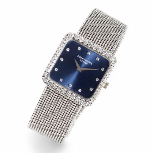 Patek Philippe. An 18ct white gold and diamond set manual wind bracelet watch