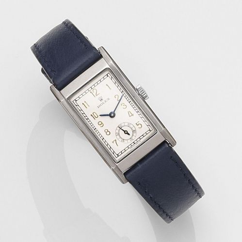 Rolex. A stainless steel manual wind wristwatch