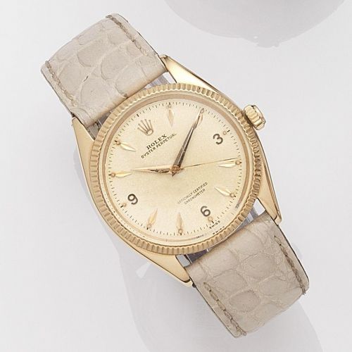 Rolex. An 18k rose gold automatic wristwatch