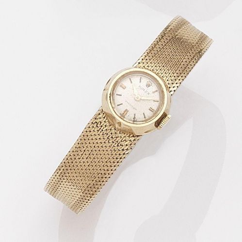 Rolex. A lady's 18k rose gold manual wind bracelet watch