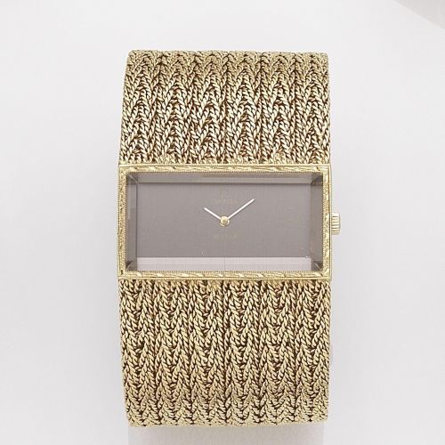 Omega. An 18k gold manual wind bracelet watch