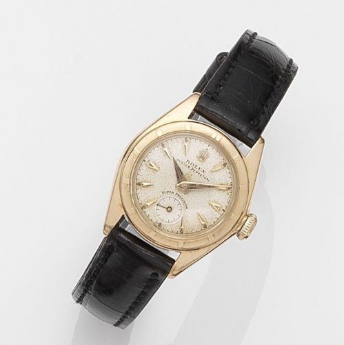 Rolex. A lady's 18k gold automatic bubbleback wristwatch