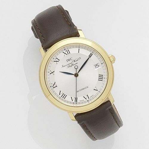 IWC. An 18k gold automatic calendar wristwatch