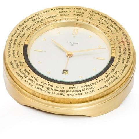 Luxor. A gilt metal keyless wind 8 day calendar alarm desk clock with world time bezel
