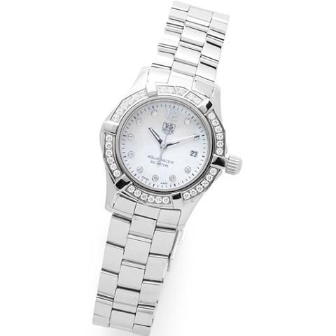 TAG Heuer. A stainless steel, mother-of-pearl and diamond set quartz bracelet watch with box and papers