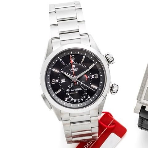 Tudor. A stainless steel automatic alarm calendar bracelet watch with box and papers