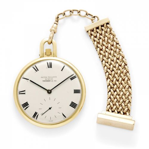 Patek Philippe. A fine 18k gold open face dress watch and a gold fob