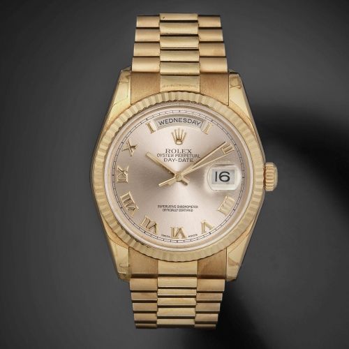 Rolex. A fine 18K rose gold automatic calendar bracelet watch