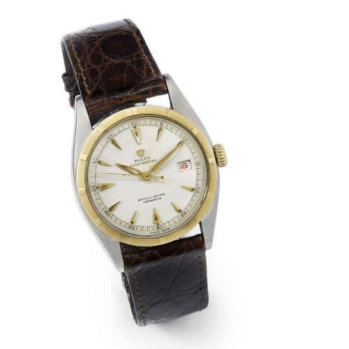 Rolex. A stainless steel and gold automatic calendar wristwatch with red date