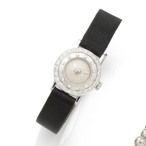 LeCoultre. A lady's 14K white gold and diamond set manual wind wristwatch