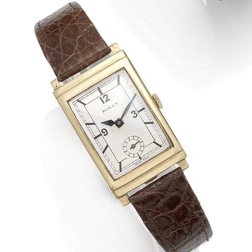 Rolex. A 9k gold manual wind wristwatch