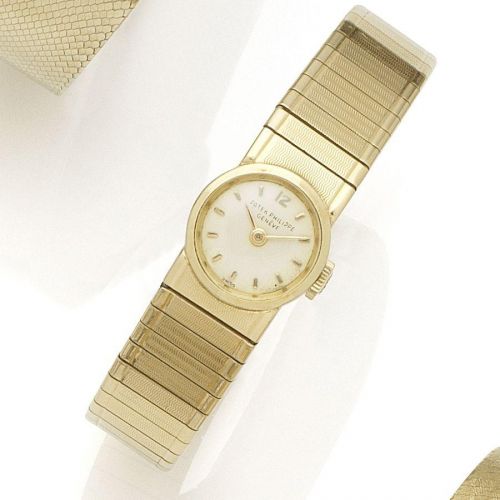Patek Philippe. A lady's 18K gold manual wind bracelet watch