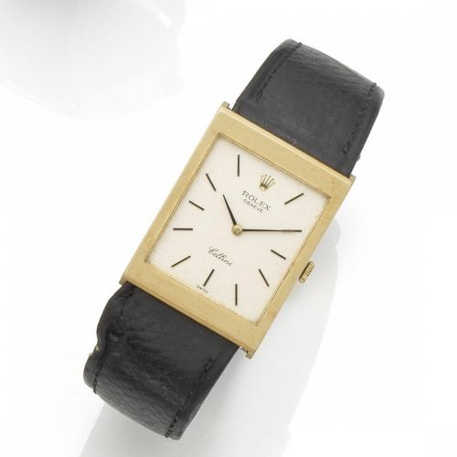 Rolex. An 18K gold manual wind wristwatch