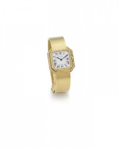 Cartier. A lady's 18K gold and diamond set manual wind bracelet watch