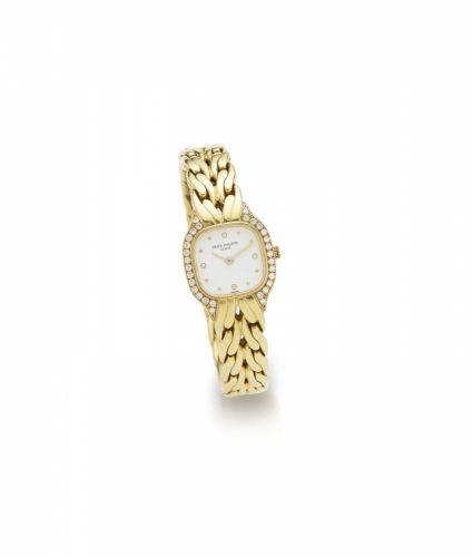 Patek Philippe. A lady's 18K gold and diamond set quartz bracelet watch