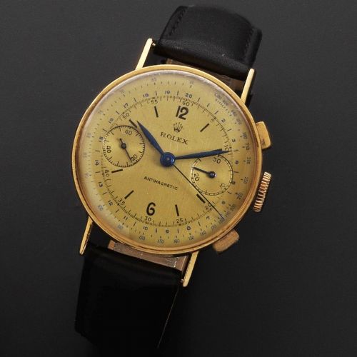 Rolex. An 18K gold manual wind chronograph wristwatch