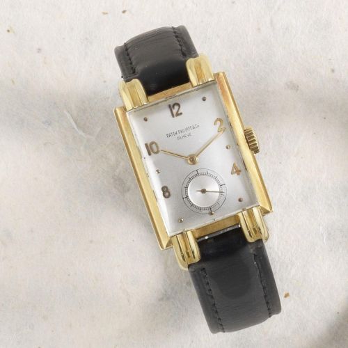 Patek Philippe. An 18K gold rectangular manual wind wristwatch