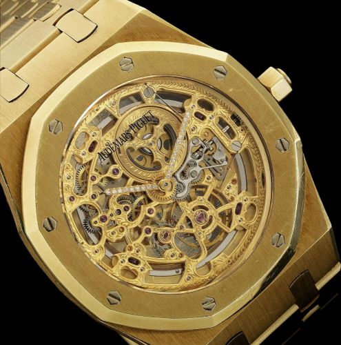 Audemars Piguet. A fine 18K gold automatic tonneau bracelet watch with skeletonised dial