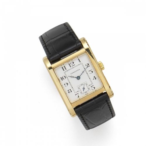 Longines. An 18K gold manual wind rectangular wristwatch