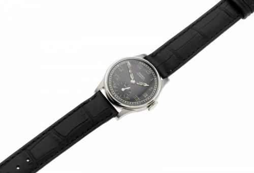 Moeris. A stainless steel manual wind wristwatch
