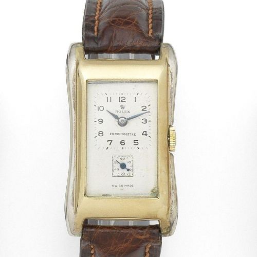 Rolex. A silver and 9k gold manual wind rectangular wristwatch