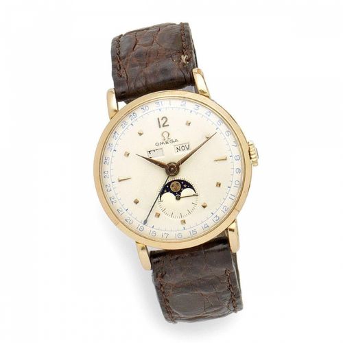 Omega. An 18K gold manual wind triple calendar wristwatch with moon phase