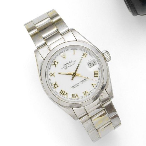 Rolex. A mid-size 18K white gold automatic calendar bracelet watch with later plated steel bracelet