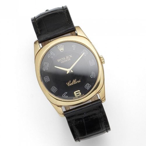 Rolex. An 18K gold manual wind cushion form wristwatch