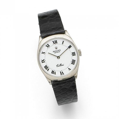 Rolex. A lady's 18K white gold manual wind wristwatch