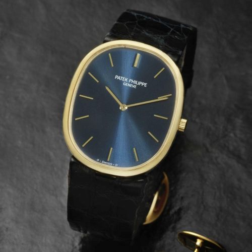 Patek Philippe. An 18K gold manual wind oval wristwatch with matching cufflinks