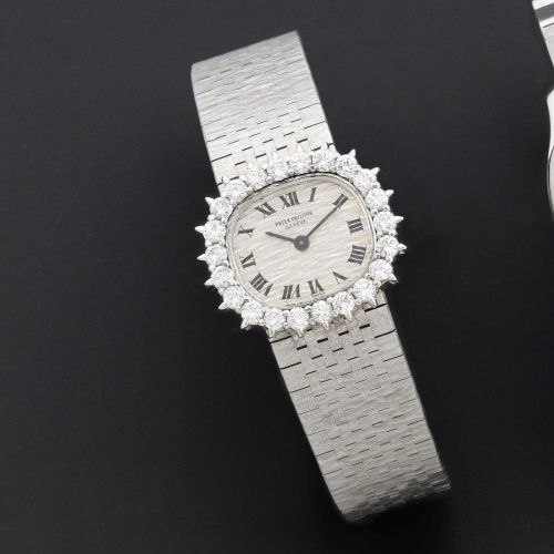 Patek Philippe. A lady's 18K white gold and diamond set manual wind bracelet watch