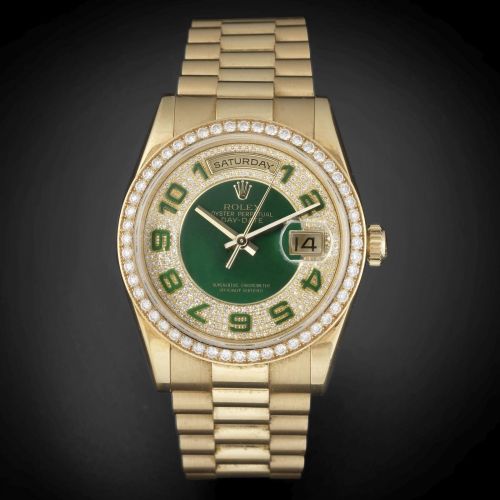 Rolex. A fine 18K gold, green enamel and diamond set automatic calendar bracelet watch