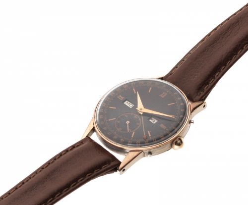 Movado. A rose gold plated and stainless steel manual wind triple calendar wristwatch