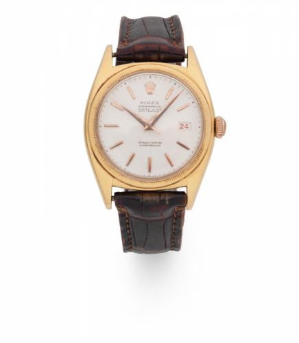 Rolex. An 18K rose gold automatic calendar wristwatch