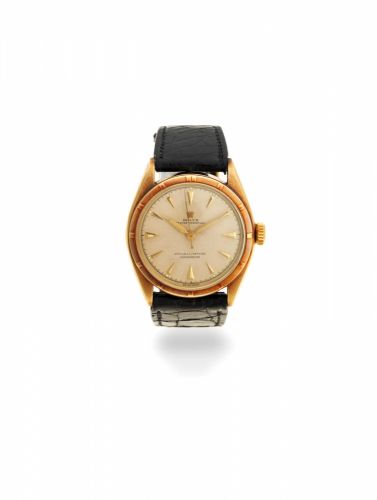 Rolex. A 14K gold automatic wristwatch