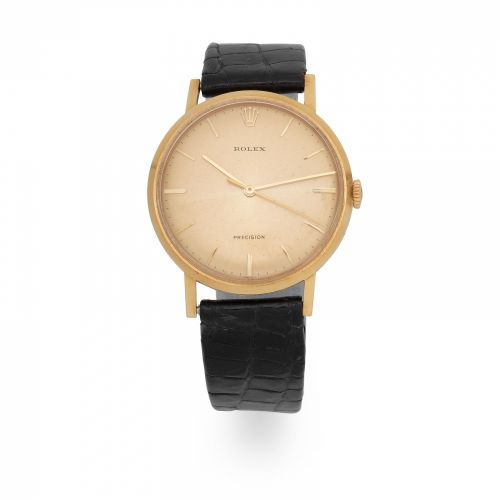 Rolex. An 18K gold manual wind wristwatch