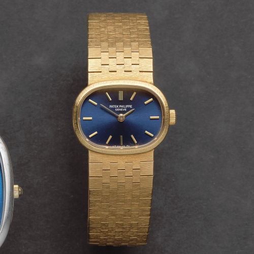 Patek Philippe. A lady's 18K gold manual wind bracelet watch
