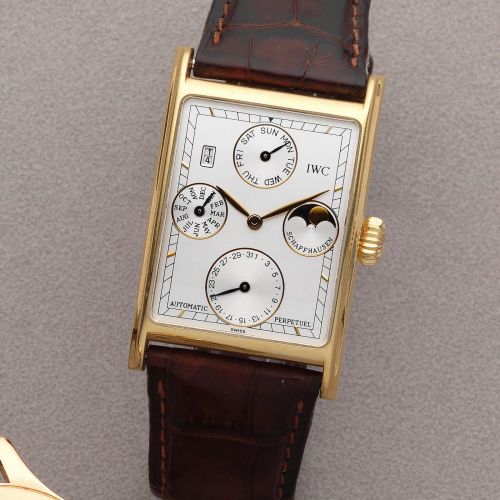 IWC. An 18K gold automatic perpetual calendar rectangular wristwatch with moon phase
