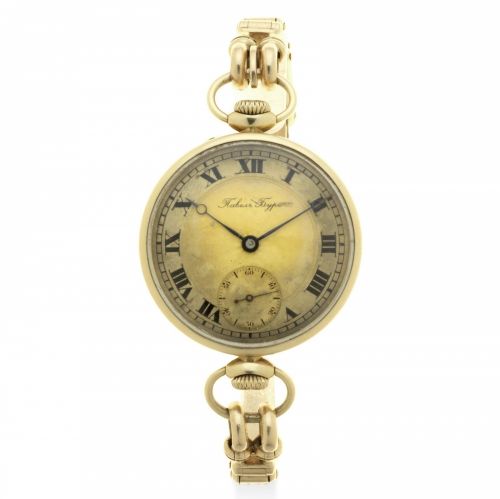 Paul Buhre. A 14K gold keyless wind converted pocket bracelet watch